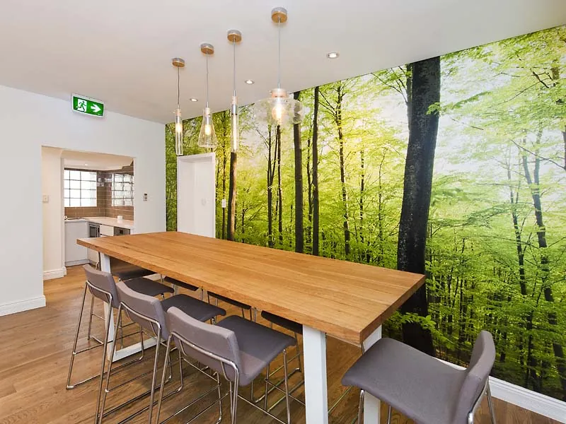 JDL Strategies — Breakout with pendant lighting and feature wall.